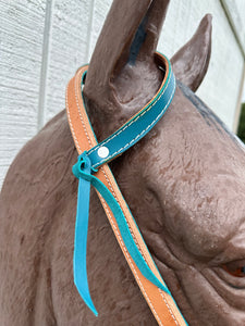 Teal leather tack set one ear and tripping collar.