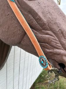 Teal leather tack set one ear and tripping collar.