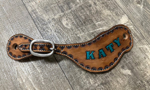 Hand tooled and painted custom spur straps