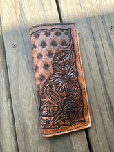 Hand tooled tally book.
