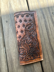 Hand tooled tally book.