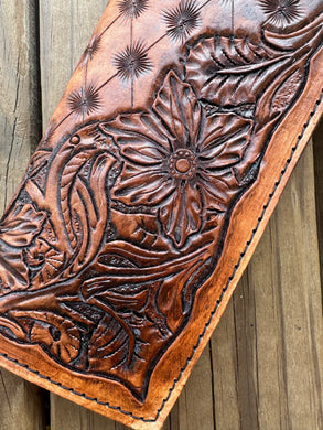 Hand tooled tally book.