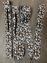 Cow print cinch strap