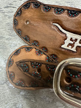 Custom Brand Hand tooled and painted  spur straps.