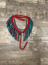 Red, black, and green turquoise fringe breast collar with a wither strap