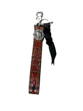 Personalized hand tooled and painted key chain wristlet