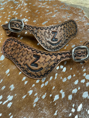 Hand tooled and painted Custom Brand spur straps basketweave.