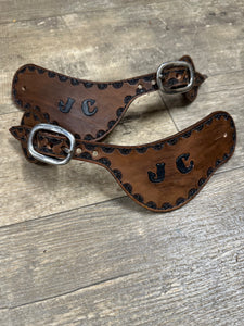 Hand tooled and painted custom spur straps brown and black