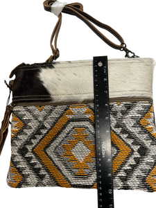 myra yellow and black cowhide canvas cross body  bag with tooled leather
